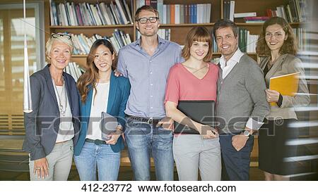 Business people smiling in office View Large Photo Image Stock Image - Business people smiling in office. Fotosearch