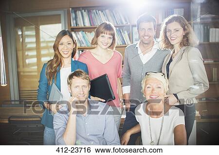 Business people smiling in office View Large Photo Image Stock Photograph - Business people smiling in office. Fotosearch