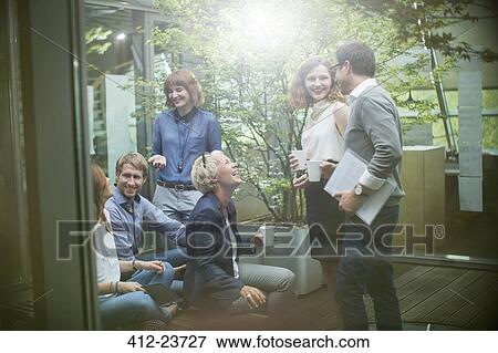 Business people talking in courtyard View Large Photo Image Stock Photo - Business people talking in courtyard. Fotosearch
