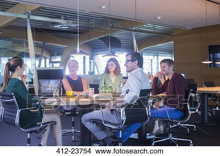 Business people talking in office meeting View Large Photo Image Picture - Business people talking in office meeting. Fotosearch