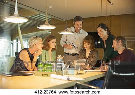 Picture - Business people talking in office meeting. Fotosearch