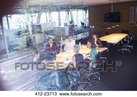 Business people talking in office meeting View Large Photo Image Stock Image - Business people talking in office meeting. Fotosearch