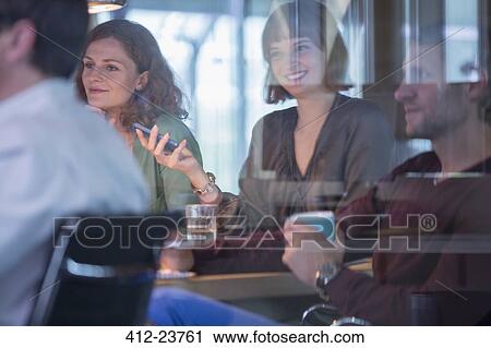 Business people talking in office meeting View Large Photo Image Stock Image - Business people talking in office meeting. Fotosearch