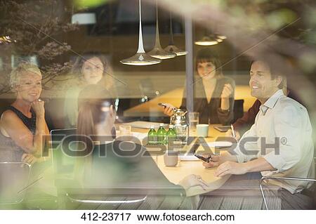 Stock Photo - Business people talking in office meeting. Fotosearch