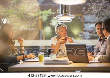 Stock Photo - Business people talking in office meeting. Fotosearch