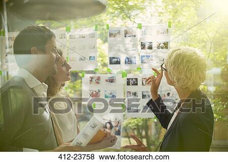 Business people talking in office View Large Photo Image Stock Photo - Business people talking in office. Fotosearch