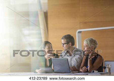 Business people talking in office meeting View Large Photo Image Stock Photo - Business people talking in office meeting. Fotosearch
