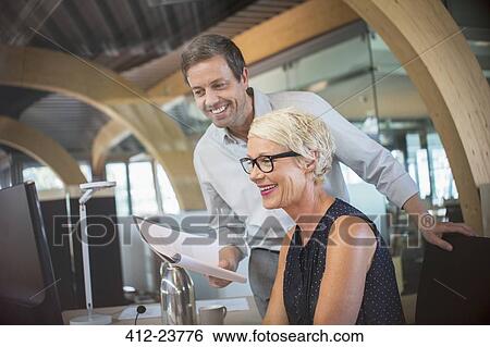 Business people talking in office View Large Photo Image Stock Photograph - Business people talking in office. Fotosearch