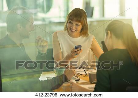 Business people talking in office meeting View Large Photo Image Stock Photograph - Business people talking in office meeting. Fotosearch
