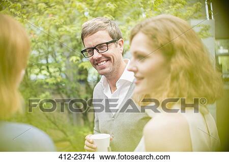 Business people talking outdoors View Large Photo Image Picture - Business people talking outdoors. Fotosearch