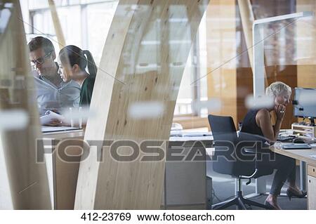 Business people working in office View Large Photo Image Stock Photo - Business people working in office. Fotosearch