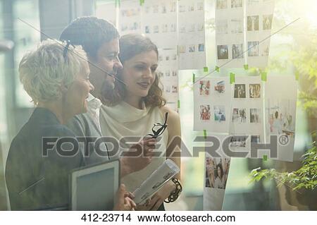Picture - Business people working together in office. Fotosearch