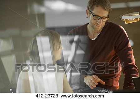 Business people working together in office View Large Photo Image Stock Photo - Business people working together in office. Fotosearch
