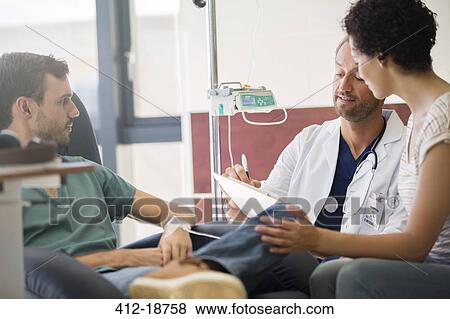 Doctor questioning patient and writing on clipboard View Large Photo Image Stock Photo - Doctor questioning patient and writing on clipboard. Fotosearch