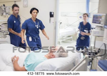 Doctors rushing to rescue patient in hospital View Large Photo Image Stock Photography - Doctors rushing to rescue patient in hospital. Fotosearch