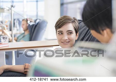 Stock Image - Female patient receiving treatment in hospital. Fotosearch