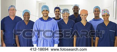 Picture - Group portrait of surgeons standing in hospital corridor. Fotosearch