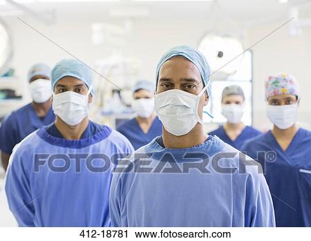 Group portrait of team of masked surgeons in hospital View Large Photo Image Stock Image - Group portrait of team of masked surgeons in hospital. Fotosearch