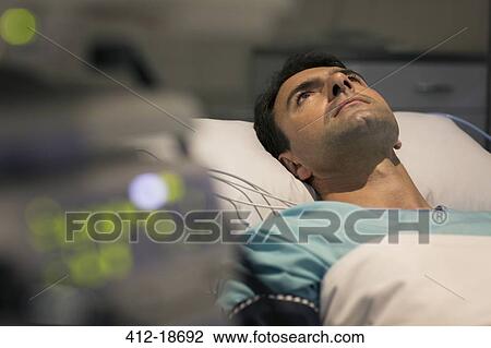 Male patient lying in hospital bed View Large Photo Image Stock Image - Male patient lying in hospital bed. Fotosearch