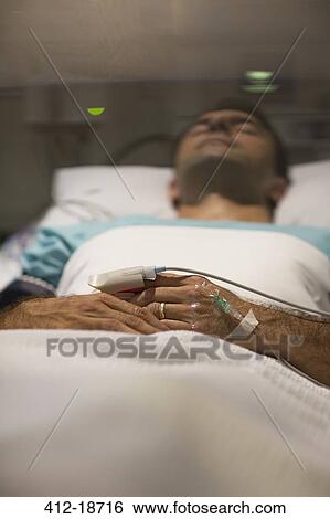 Male patient sleeping in hospital bed View Large Photo Image Stock Photograph - Male patient sleeping in hospital bed. Fotosearch