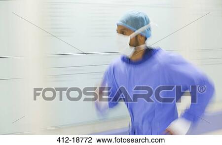 Male surgeon rushing through hospital corridor View Large Photo Image Stock Image - Male surgeon rushing through hospital corridor. Fotosearch