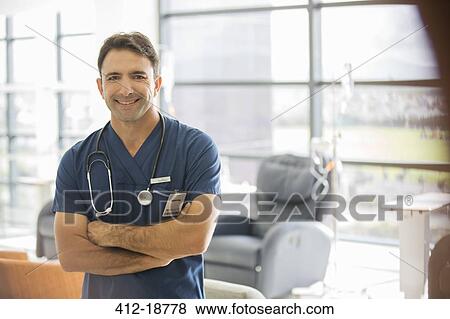 Portrait of male doctor in hospital View Large Photo Image Stock Photo - Portrait of male doctor in hospital. Fotosearch