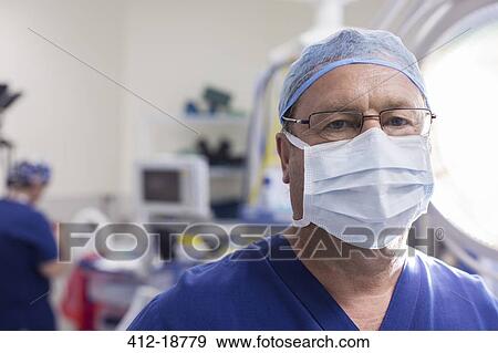 Stock Photo - Portrait of masked surgeon in hospital. Fotosearch