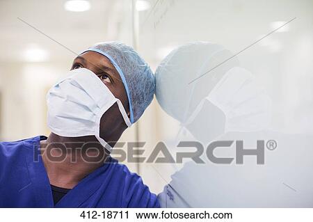 Portrait of mid adult surgeon in hospital View Large Photo Image Stock Image - Portrait of mid adult surgeon in hospital. Fotosearch