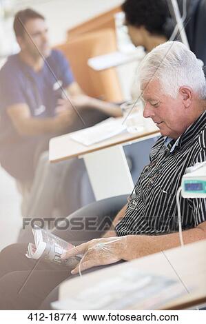 Senior man receiving intravenous infusion in hospital View Large Photo Image Picture - Senior man receiving intravenous infusion in hospital. Fotosearch