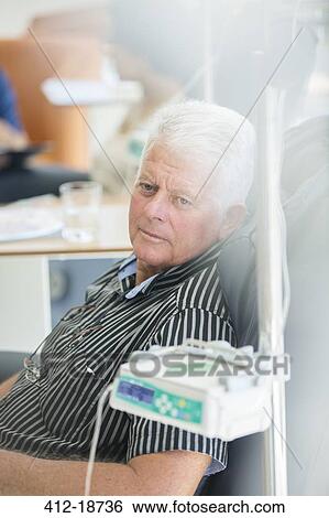 Senior man receiving intravenous infusion in hospital View Large Photo Image Stock Photograph - Senior man receiving intravenous infusion in hospital. Fotosearch