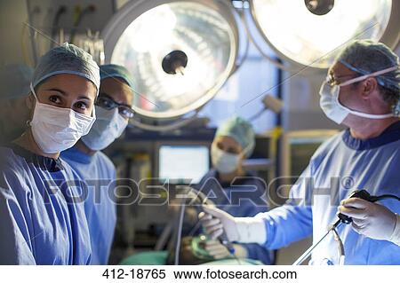 Team of surgeons during operation in operating theater View Large Photo Image Stock Photography - Team of surgeons during operation in operating theater. Fotosearch