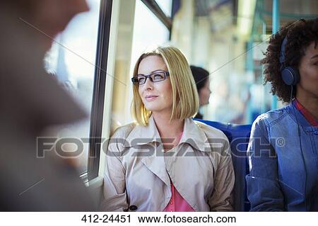 Businesswoman sitting on train View Large Photo Image Stock Image - Businesswoman sitting on train. Fotosearch