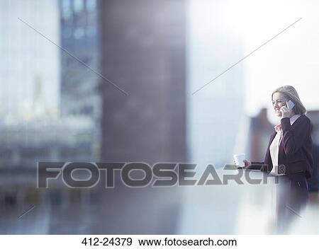 Businesswoman talking on cell phone View Large Photo Image Stock Photo - Businesswoman talking on cell phone. Fotosearch