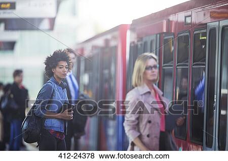 Stock Photo - People boarding train. Fotosearch