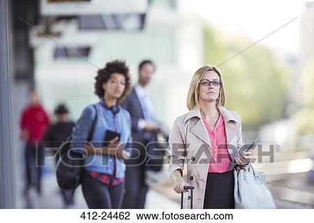 People waiting at train station View Large Photo Image Stock Image - People waiting at train station. Fotosearch
