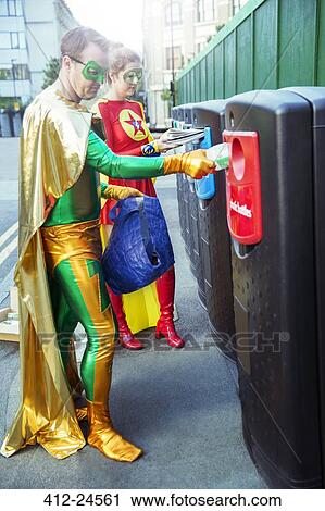 Superhero couple recycling on city sidewalk View Large Photo Image Stock Image - Superhero couple recycling on city sidewalk. Fotosearch