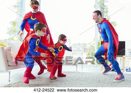 Superhero family chasing each other in living room View Large Photo Image Stock Image - Superhero family chasing each other in living room. Fotosearch
