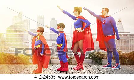 Superhero family standing with arms outstretched on city rooftop View Large Photo Image Stock Photography - Superhero family standing with arms outstretched on city rooftop. Fotosearch