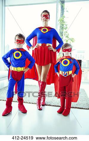 Superhero mother and children standing in living room View Large Photo Image Stock Photo - Superhero mother and children standing in living room. Fotosearch