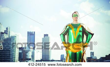 Superhero standing near city skyline View Large Photo Image Stock Photography - Superhero standing near city skyline. Fotosearch