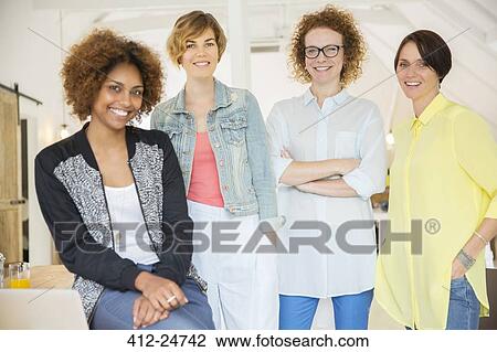 Group of smiling women at work View Large Photo Image Stock Image - Group of smiling women at work. Fotosearch