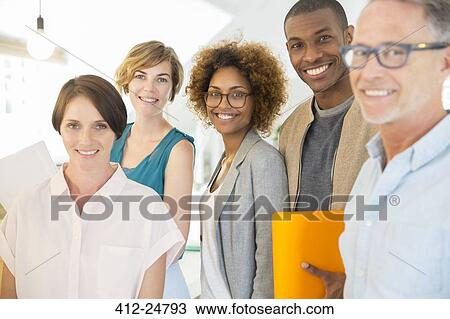 Stock Image - Group portrait of smiling office workers. Fotosearch