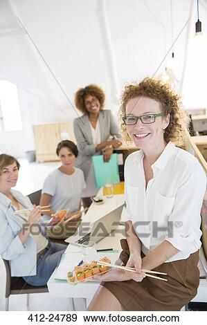 Office workers having lunch together View Large Photo Image Stock Photo - Office workers having lunch together. Fotosearch