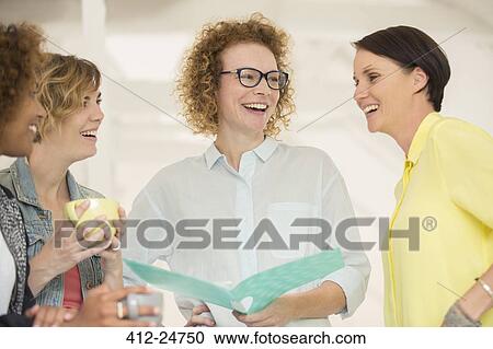Stock Image - Portrait of laughing office workers. Fotosearch