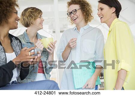 Stock Image - Portrait of laughing office workers. Fotosearch
