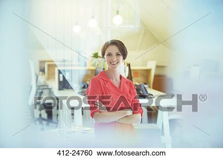Portrait of smiling office worker with crossed hands View Large Photo Image Stock Image - Portrait of smiling office worker with crossed hands. Fotosearch