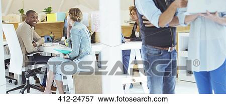 Stock Photo - Portrait of talking office workers. Fotosearch