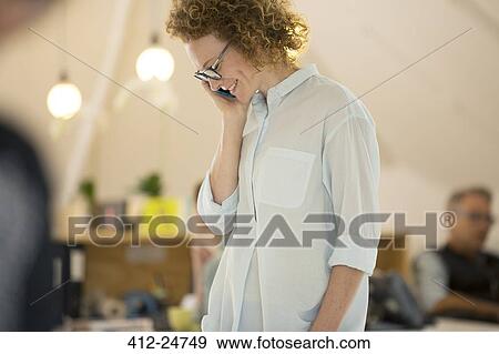 Stock Photo - Portrait of woman talking on phone. Fotosearch