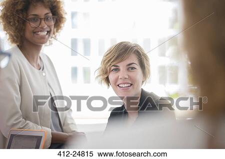 Portrait of women smiling against window View Large Photo Image Stock Photography - Portrait of women smiling against window. Fotosearch