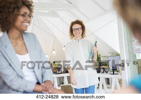 "Woman walking and carrying laptop, joining colleague from office" View Large Photo Image Stock Photo - "Woman walking and carrying laptop, joining colleague from office". Fotosearch